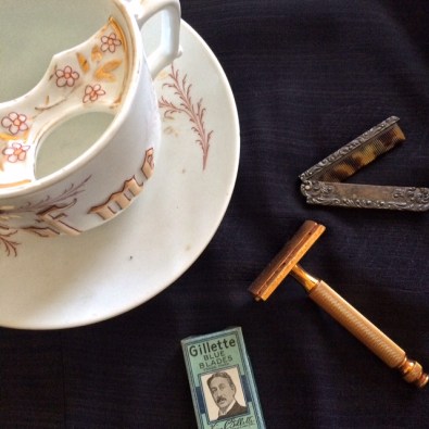mustache cup, comb, and gillette razor